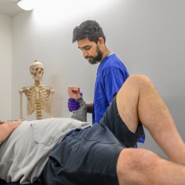 A nurse examines a petient's arm