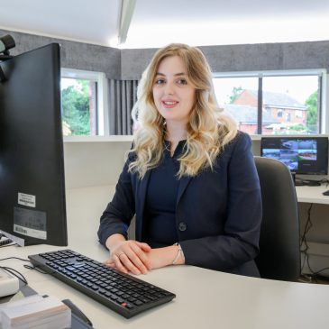 A receptionist at their desk