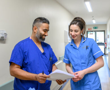 Nurses in discussion over a file