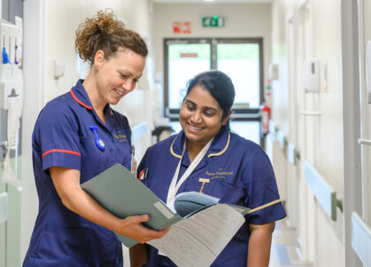 Nurses discussing patient notes